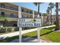 A sign displays the community name, 3111 Pass A Grille Way, Marina Bay with nautical-themed design elements at 3111 Pass A Grille Way # 213, St Pete Beach, FL 33706