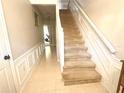 Inviting entryway with tiled floors and a staircase leading to the upper level at 3128 Bayshore Oaks Dr, Tampa, FL 33611