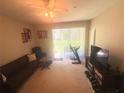 Cozy living room with carpet, providing a comfortable space for relaxation at 3128 Bayshore Oaks Dr, Tampa, FL 33611