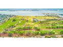 Panoramic aerial of waterfront golf course with city skyline in the background at 316 Barbara Cir, Belleair, FL 33756