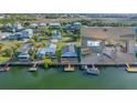 Waterfront home with a dock in a coastal community, complemented by an inviting interior living space at 3515 Centavo Ct, Hernando Beach, FL 34607