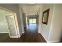 Inviting foyer with hardwood floors leading to the bright living area at 514 Cedar Woods Dr, Oldsmar, FL 34677