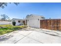 Charming single-story home featuring a garage, a red front door, with a large driveway at 5881 31St N Ave, St Petersburg, FL 33710