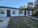 Attractive single-story residence featuring a modern color scheme and well-maintained landscaping at 814 W 129Th Ave, Tampa, FL 33612