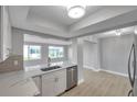 Open-concept kitchen featuring a quartz countertop and stainless steel appliances at 9915 39Th N St # 3, Pinellas Park, FL 33782
