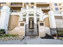 Elegant entryway with wrought iron gate leading to luxurious condominium at 11 Baymont St # 1403, Clearwater Beach, FL 33767