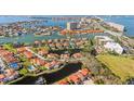 Aerial view of waterfront community featuring beautiful homes, lush landscaping, and serene lake at 18 Crescent S Pl, St Petersburg, FL 33711