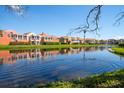 Scenic waterfront homes boast lush landscaping and tranquil lake views at 18 Crescent S Pl, St Petersburg, FL 33711