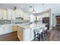 Modern kitchen featuring a large center island, updated appliances, and an abundance of counter space at 344A Bay St, Palm Harbor, FL 34683