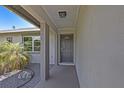 Inviting front entrance with a decorative door and manicured landscaping at 3456 Roslyn Rd, Venice, FL 34293