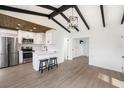 Bright kitchen featuring stainless steel appliances, white cabinets, and quartz countertops at 679 71St N Ave, St Petersburg, FL 33702