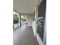 View of the porch with palm trees in the background at 946 Virgina # 304, Dunedin, FL 34698