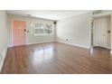 Spacious living room featuring wood-look floors and a large window with natural light at 1751 8Th Sw Ave, Largo, FL 33770
