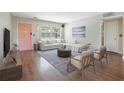 Bright living room with large windows, stylish furniture and a decorative rug at 1751 8Th Sw Ave, Largo, FL 33770