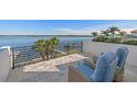 Enjoy outdoor living on the rooftop deck featuring comfortable seating and serene waterfront views at 1843 Bayou Grande Ne Blvd, St Petersburg, FL 33703