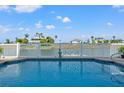 Backyard pool offers serene water views in this beautiful outdoor space at 3415 Croaker Dr, Hernando Beach, FL 34607