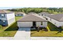 Charming single-story home with well-maintained landscaping and inviting curb appeal at 38602 Finn Clover Ln, Zephyrhills, FL 33540