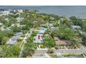 Aerial view showcasing the home's proximity to the water and lush green surroundings at 400 5Th S Ave, Safety Harbor, FL 34695