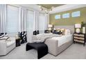 Comfortable main bedroom featuring neutral walls, contemporary furnishings, and a well-lit space with modern lighting at 4717 W Mccoy St # 18, Tampa, FL 33616