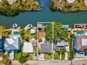 Aerial view of property with a private dock; borders a canal for easy boating access at 4834 W Flamingo Rd, Tampa, FL 33611