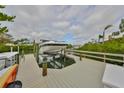 A private boat dock with lift provides access to waterfront living at 6467 Rubia Cir, Apollo Beach, FL 33572