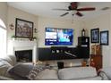 Cozy living room with modern TV, fireplace, neutral walls, and comfortable seating at 6513 Sand Shore Ln, New Port Richey, FL 34652