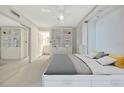 Serene main bedroom with ample storage and modern design, leading into the en-suite bath at 9 Haig Pl # 310, Dunedin, FL 34698