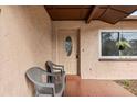 Front porch with a tiled floor and seating area at 9287 Horizon Dr, Spring Hill, FL 34608