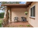 Front porch with a stone archway and seating area at 9287 Horizon Dr, Spring Hill, FL 34608