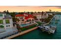 Stunning waterfront home with a private boat dock, outdoor kitchen, and a luxurious swimming pool at 940 Monte Cristo Blvd, Tierra Verde, FL 33715
