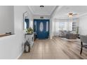 Elegant foyer showcasing tile flooring, a striking front door, and views into the adjacent living area at 13424 Hunters Point St, Spring Hill, FL 34609