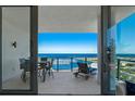 Relax on your private balcony with ocean views and space for seating, accessible through sliding glass doors at 301 1St Street S # 1901, St Petersburg, FL 33701
