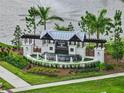 Elegant community entrance with lush landscaping and a decorative water feature at 3528 Golden Wheat Ln, Plant City, FL 33565