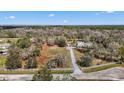 Sprawling property featuring a two-story home, long driveway, and ample acreage at 403 Indian Meadow Ct, Wimauma, FL 33598