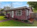 Quaint brick home with lush green lawn and garden beds in a suburban setting at 4424 19Th N St, St Petersburg, FL 33714