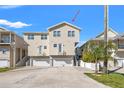 A charming, multi-level house with a two-car garage, balcony, and well-maintained landscaping, perfect for comfortable living at 4859 W Prescott St, Tampa, FL 33616