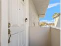 A welcoming front entrance featuring a stylish door, modern hardware, and a secure keypad for convenient access at 4859 W Prescott St, Tampa, FL 33616