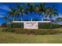 Waterset community entrance sign surrounded by lush landscaping and mature palm trees under a blue sky at 5647 Del Coronado Dr, Apollo Beach, FL 33572
