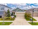 Lovely single-story home with a well-manicured lawn and attached two-car garage in a quiet neighborhood at 5647 Del Coronado Dr, Apollo Beach, FL 33572