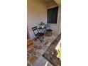 Charming front patio with table and chairs, perfect for enjoying the outdoors at 1102 Old Mill Pond Rd, Palm Harbor, FL 34683