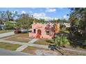 A single Gathering peach colored home with an arched entryway and small front yard at 1900 17Th S St, St Petersburg, FL 33712