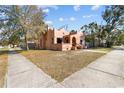 A unique single Gathering home on a corner lot featuring colorful walls and mature trees at 1900 17Th S St, St Petersburg, FL 33712