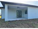 Covered patio with a ceiling fan, offering an ideal outdoor living and relaxation space at 9 Tee View Rd, Rotonda West, FL 33947