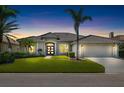 Charming single-story home featuring lush landscaping, a tile roof, and a well-manicured front lawn at 1038 Grouse Way, Venice, FL 34285