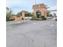 Gated community entrance with palm trees and manicured landscaping at 12760 Indian Rocks Rd # 1066, Largo, FL 33774
