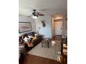 Cozy living room features hardwood floors, leather furniture, and modern décor at 1810 E Palm Ave # 7104, Tampa, FL 33605