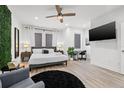 Modern bedroom features a large bed, sleek furnishings, and a ceiling fan for added comfort at 2808 N Florida Ave, Tampa, FL 33602