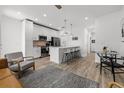 Open-concept kitchen with stainless steel appliances, island with breakfast bar, and modern finishes at 2808 N Florida Ave, Tampa, FL 33602