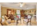 Inviting living room with comfortable seating and an adjacent dining area at 4006 Crockers Lake Blvd # 212, Sarasota, FL 34238