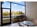 Relaxing balcony with a view of the lake and fountain feature at 4813 Michelle Ln, Palm Harbor, FL 34684